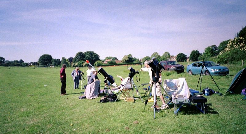 Transit of Venus, June 2004
An array of telescopes with various solar filters being set up in the boot fair field at Chelsfield to observe the Transit of Venus on 8th June 2004.
Link-words: LocalArea2004