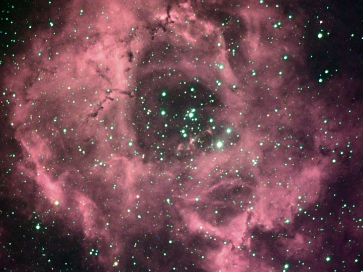 The Rosette Nebula NGC 2244
Nebula in Monoceros. This consists of a star cluster surrounded by a giant cloud of gas, from which the stars in the cluster were formed.

Is is 130 ly in diameter & is 2,600 ly from Earth. 
Link-words: Nebula