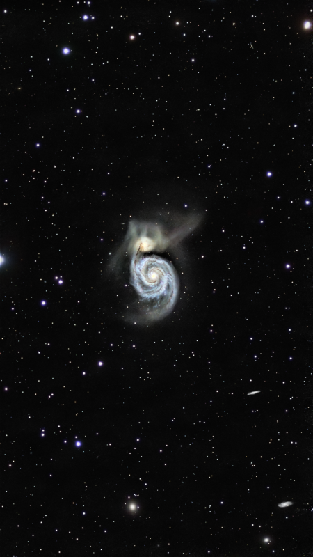 Messier 51 
M51 is a pair of interacting galaxies, NGC 5194 and NGC 5195, their last close approach was about 400 million years ago. They are now 500,000 light years apart with the smaller NGC5195 behind the larger galaxy. That last closest approach caused an enormous amount of star formation in the larger galaxy. We can see this happening in the spiral arms as blue and pink blobs. The close approach also stripped stars out of the galaxies and we see them as a glow of streamers emitted from the galaxies.

The galaxy was first seen by Charles Messier in 1773, although he only saw the brighter of the two galaxies, it wasn’t until 1781 when Pierre Méchain observed the companion galaxy. It wasn’t until the 19th before the spiral structure of the galaxy was discovered by the 3rd Earl of Rosse in Ireland using his 72” telescope known as the Leviathan of Parsonstown in 1848. The first photograph of M51 was taken in 1889.

There have been four recent supernovae in M51, 1945, 1994, 2005 and 2011. So it’s one worth keeping an eye on.

This image was taken over 13 nights through April and May 2025, with the SeeStar S50. A total exposure of 25h 10m 20s made from 20 and 30” subs, processed with PixInsight
Link-words: Messier 51 seestar