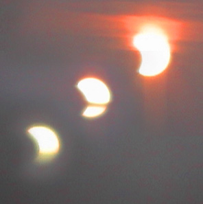Partial Eclipse
It was very early in the morning! Although the conditions were not ideal, the sun rose in eclipse and slowly the Moon's disk passed off the Sun's as it rose over the horizon as seen from high ground at Fairlight, near Rye, Sussex.
Link-words: Sun