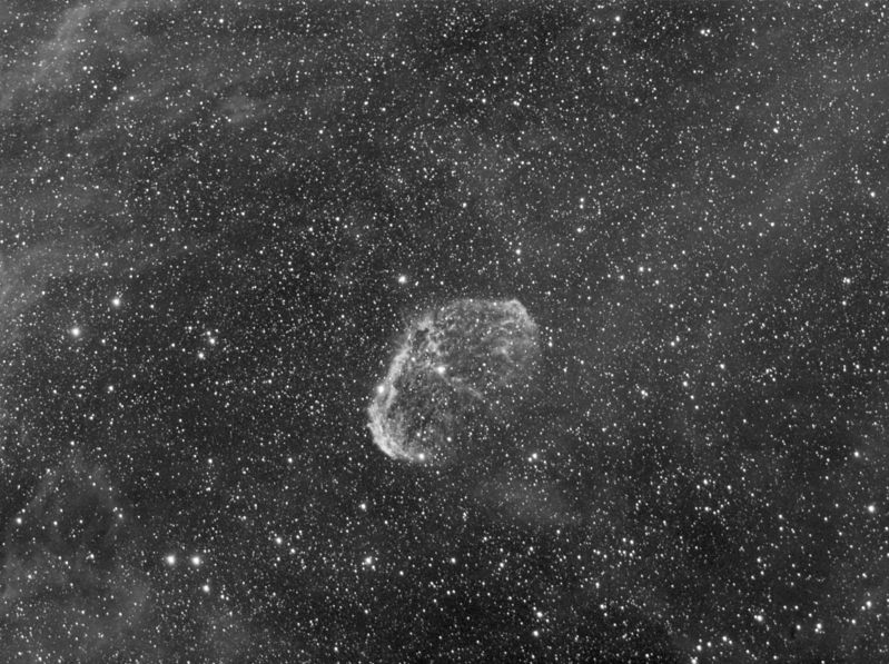 NGC6888 Crescent Nebula - reprocessed
Crescent nebula and starfield showing some of the faint nebulosity around it.  The Nebula has been produced by the Wolf-Rayet star in the center of the nebula.

20 * 300s unguided with the Sky90 + F/4.5 reducer/flattener.  No Bias/ Flat or Darks.

After looking at some others on the web I decided that it needed a second look.  It seems I got the black level far too high in Maxim so I've reprocessed to bring out the nebulosity that was hidden before.
Link-words: Nebula