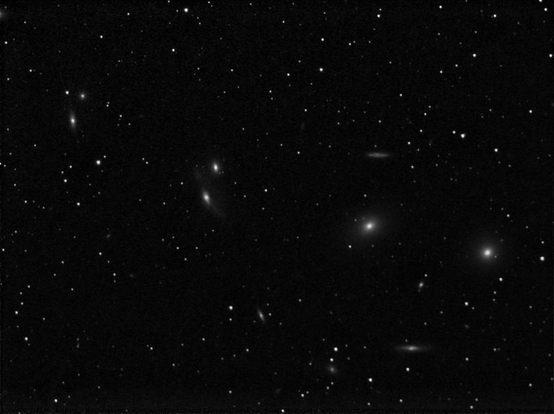 Markarians Chain - Deep sky challenge 
Markarians chain of galaxies in the Virgo Cluster on the border of the constellations of Coma Berenices and Virgo.

The brightest galaxy in this image is M86 at magnitude 8.9 and the faintest that I have measured is 18.8 although there are fainter but I've no useful way of measuring their brightness to any accuracy.

Image taken when within 98% of full moon giving a sky background adu of approx 45000-46000 and a nightmare gradient.

Sum of 20 x 5 minutes binned 1x1
Link-words: Galaxy
