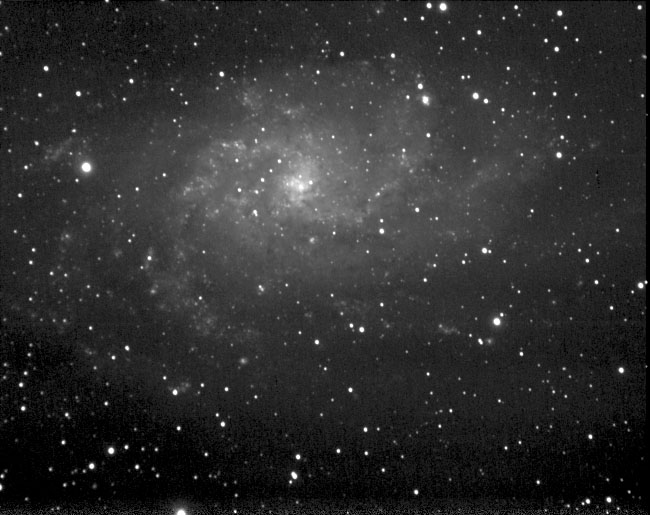 M33 Pinwheel (Triangulum) Galaxy from DSC Headcorn
M33, known as the Pinwheel Galaxy or the Triangulum Galaxy is a face-on galaxy located relatively close to the Milky Way at approximately 2.3 million light-years, in the Constellation Triangulum. It can be seen in binoculars as a faint glow as its light is spread out over a large field of view. M33 is a member of our local group of galaxies, the third largest at 50,000 light-years in diameter, and is probably a satellite galaxy of M31, the Andromeda Galaxy. M33's galactic arms appear turbulent with many HII regions, glowing in red, and hot blue stars, which high resolution images bring out nicely.
Link-words: Messier Galaxy