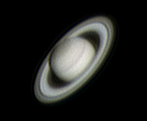 Saturn in March, using a Meade ETX125
I was having my usual issues collimating my telescope, and I happened to have the Societies Meade ETX125 in my house following deep sky cam.  I was aware the Meade had quite an awful mount but I decided to have a go at imaging using it anyway.  After 30 minutes spent focusing the telescope at -5c, I imaged Jupiter and Saturn.  With this Saturn image I had to combine three sets of AVI images to get the final result.  I believe I've captured the Enckle minima ring as well as the larger ring around the planet.
Link-words: Saturn