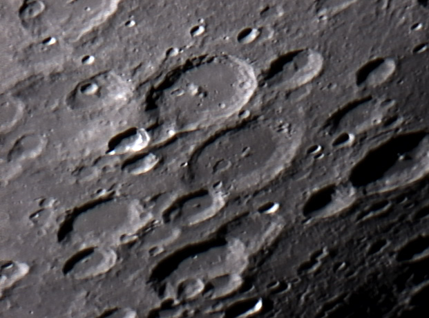 Vlacq
Vlacq Crater (with the prominent central peak) on the Moon. This image shows detail down to a mile or less, and was my first serious attempt at imaging the Moon in such fine detail.
Link-words: Moon