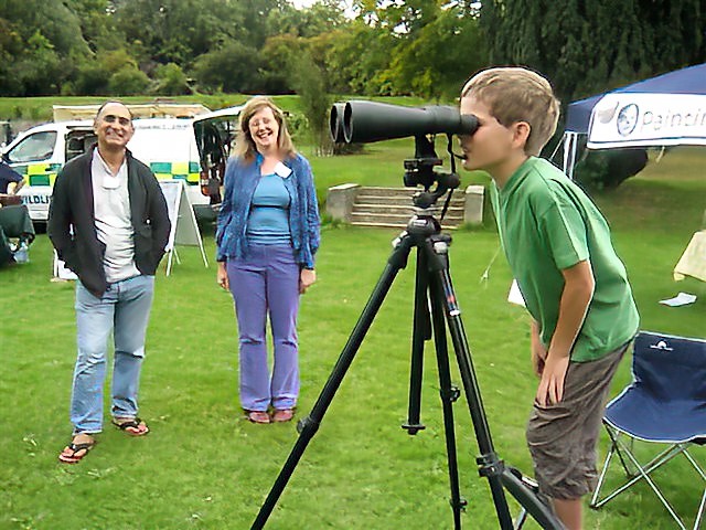 Open Day various stalls. Sue and Jim letting a youngster peek through the large binoculars. 
Link-words: HighElms2010