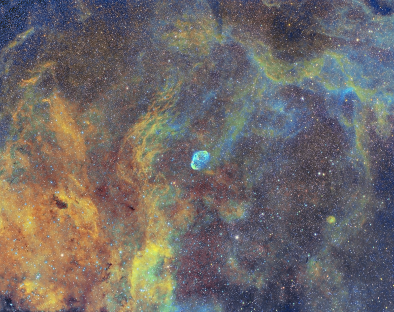 Crescent nebula and Surrounds 
Taken over 2 short nights during nautical twilight in Bromley
SHO palette with added RGB stars

Atik 460EX, Samyang 135mm F2 lens @ F2.8
Guided on HEQ5
Ha 15 x 600secs (2 1/2 hours)
Oiii 7 x 600 secs (1 hour 10 mins)
Sii 8 x 600secs (1 hour 20mins)
RGB 3 x 150secs Each 22.5 mins

Total 5 hours 22.5 mins
Link-words: CarolePope