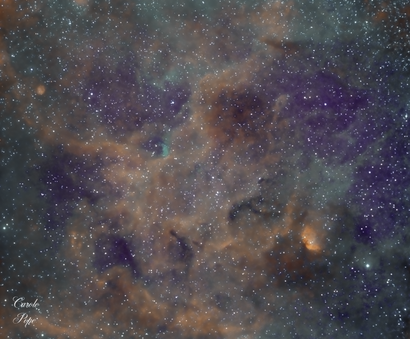 Tulip Nebula showing the surrounding gas and dust. Single image with Samyang 135mm lens.
I added some data taken last year with a smaller lens and tried to add it into the mix, so the right hand side has twice as much Ha data than the left hand side.

Ha 20 x 600secs on Left and 43 x 600secs on the right. Baader 7.5nm
Oiii 16 x 300 binned x 2
Sii 13 x 300 binned x 2
Atik460EX and Atik428EX with Samyang 135mm F2 lens @ f2.8
HEQ5
Total imaging time 9h 35m
Link-words: CarolePope