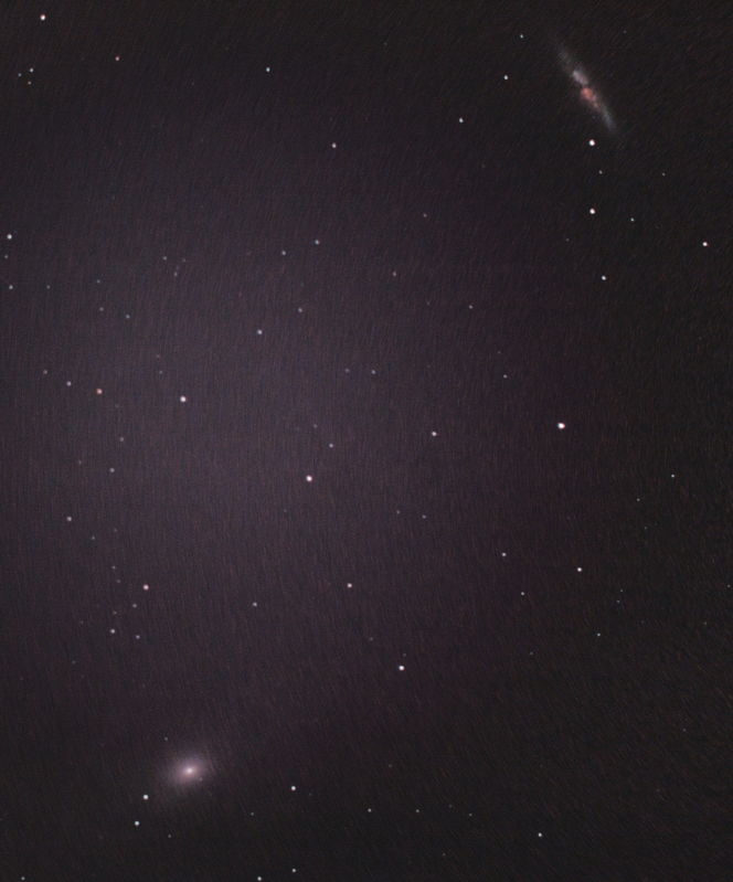 M81 and M82
9 x 4m subs, Minolta Dynax D7, Orion Skyglow SCT filter, Baader Alan Gee II Telecompressor, guided with SPC900NC with B/W chip modification and PHD. Processed in Deep Sky Stacker and The Gimp.

There is a lot of vignetting caused by the Skyglow filter moving the CCD too far away from the focal reducer flattener. If I don't use the filter I only get orange skies. 
Link-words: Messier Galaxy Duncan