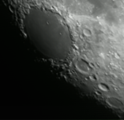 The Moon - Mare Crisium
Around 30-60 second subs processed in Registax. 6" Newtonian on HEQ5 Pro tracking mount. Celestron NexImage CCD camera with 2X Barlow. 
Link-words: Moon
