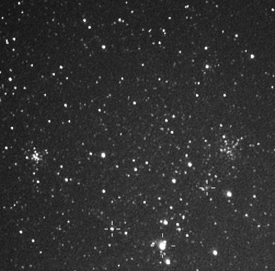 M36 & M38
These two star clusters are well rendered in this CCD image of Auriga. Paul has also captured many other interseting objects not readily seen in the original image. 
Three identified objects:-
 Bottom Left
 NGC1931 appears to be an open star cluster involved with a reflection nebula. 
Bottom Middle
 Stock 8 is an anonymous group of stars so named in 1956. 
Bottom Right
 NGC1907 is a star cluster at a distance of 2,500pc.
Link-words: Messier Galaxy Star