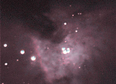 Orion Nebula - Trapezium
Within the heart of the Orion Nebula is the birthplace of planetary systems.  The four stars in the middle of this view are referred to as the Trapezium. 
This photograph clearly shows the detail and colour within this cloud of dust and gas.
Link-words: Messier Nebula
