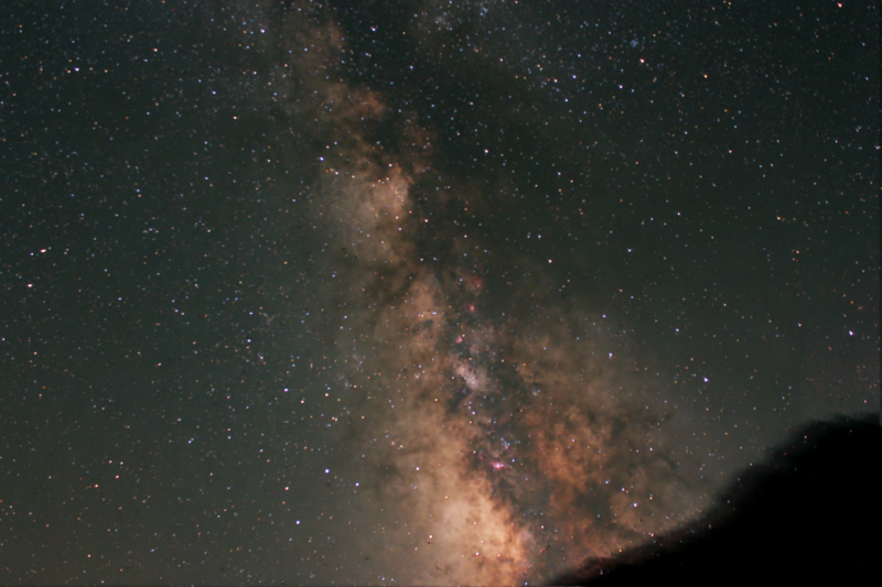 Milky Way from La Palma
Taken with tracker, Canon DSLR and kit lens, and intervalometer.
Mountain in the way of the Southern sky.
Taken at almost the top of Roques de los Muchachos (where the Observatories are).
3 exposures  2 1/2 mins, 4mns, 4 1/2 mins total time 11 minutes.
Takne during the OAS trip to la Palma. 
Link-words: CarolePope