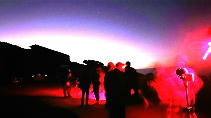 Setting up on the Mountains
Lots of red lights, Carole in Ghostly silhouette on the right.  
On roques to do los Muchachos range, just below the Observatories 2426 metres (up above the clouds)
Link-words: LaPalma2024