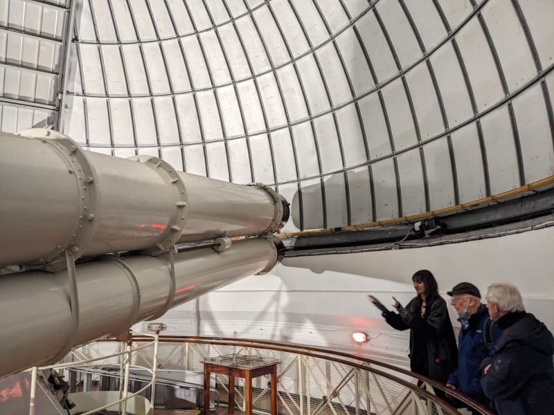 The Radcliffe telescope is housed in the largest dome is a 24" refractor with a 7m focal length.  The floor can be raised and lowered as required and has handy bell hanging to warn if the floor is rising too close to the bottom of the scope,
Link-words: MillHill2023